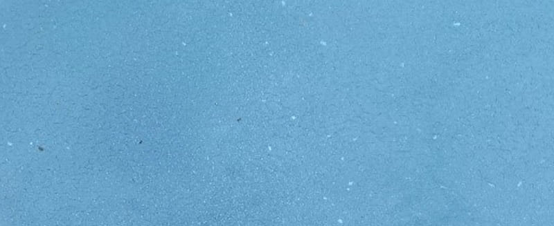 Why are there white flakes in my pool?